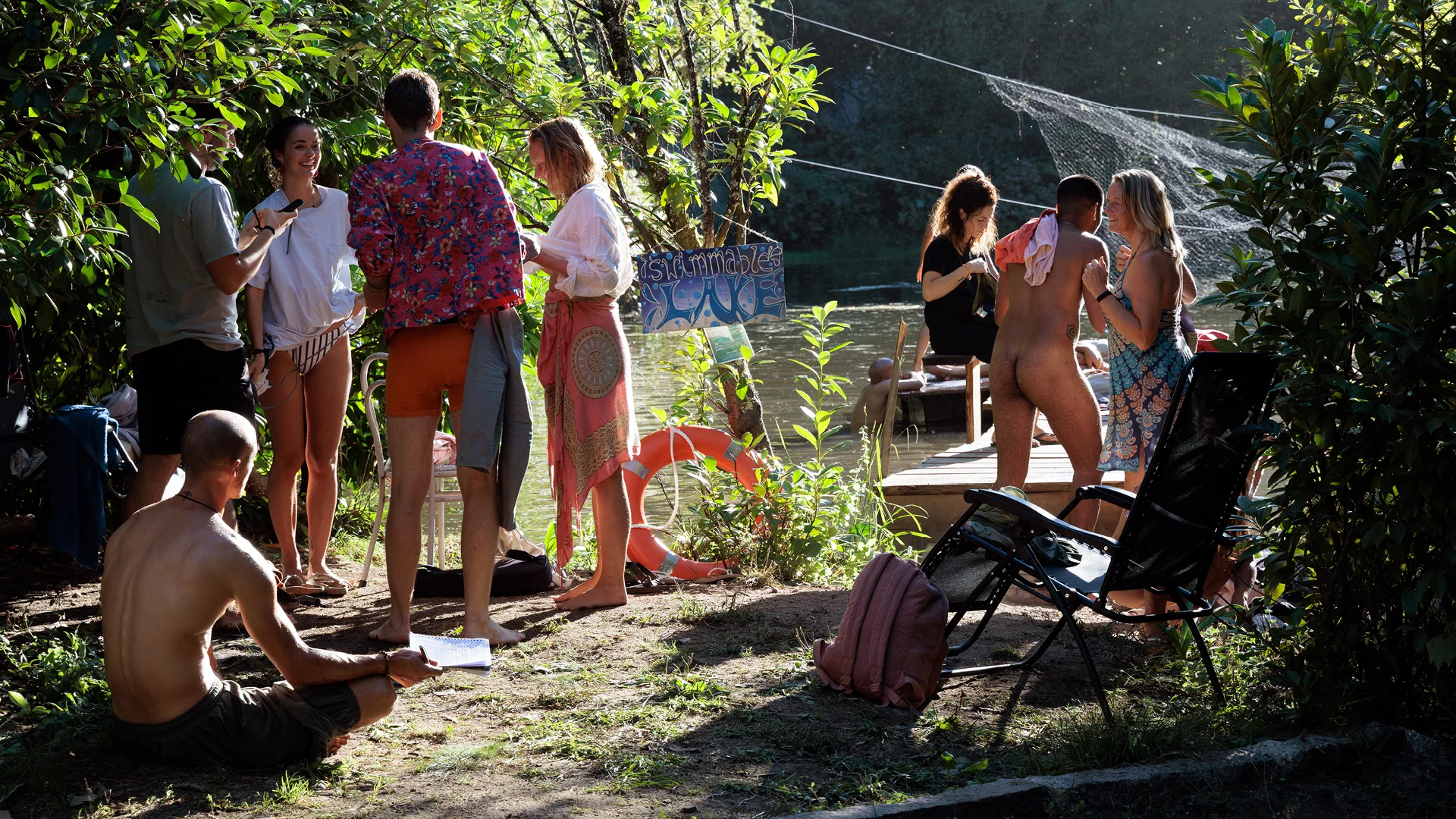 People partying by the lake during a gathering in portugal