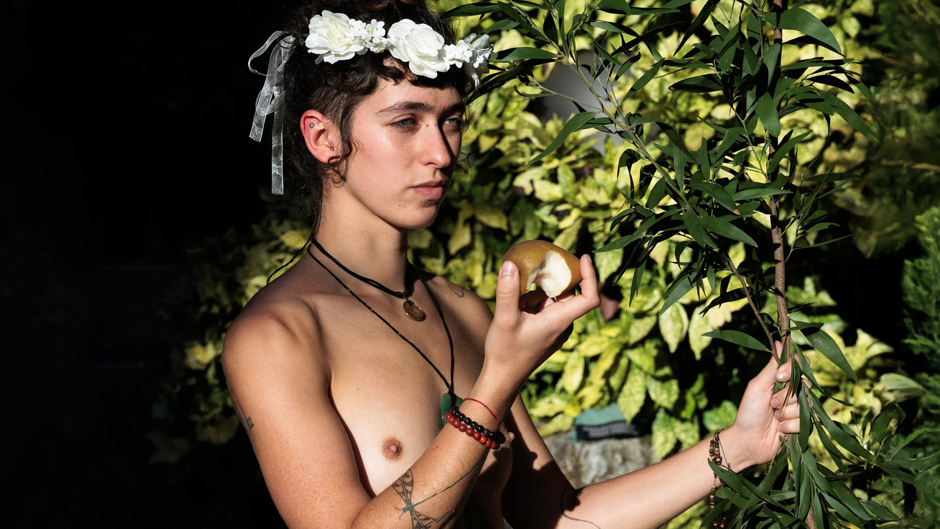 Young woman posing naked at a regenerative festival