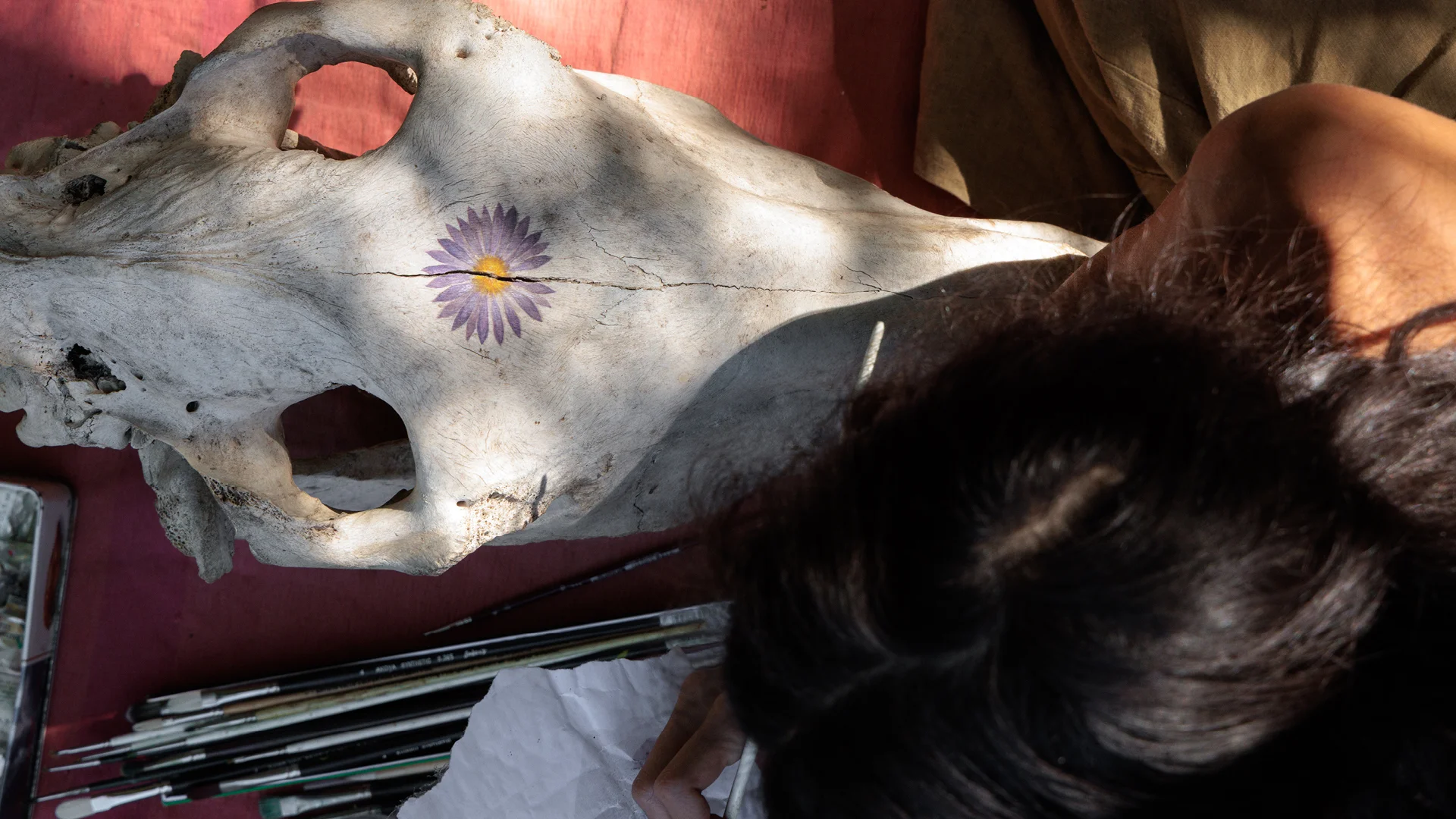 close up of a women painting at the gathering of tribe