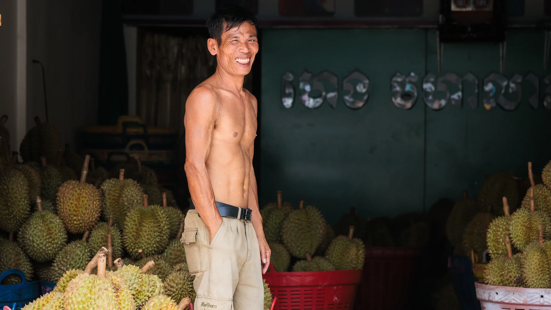 Man in front of Durian in the street of Phnom Penh