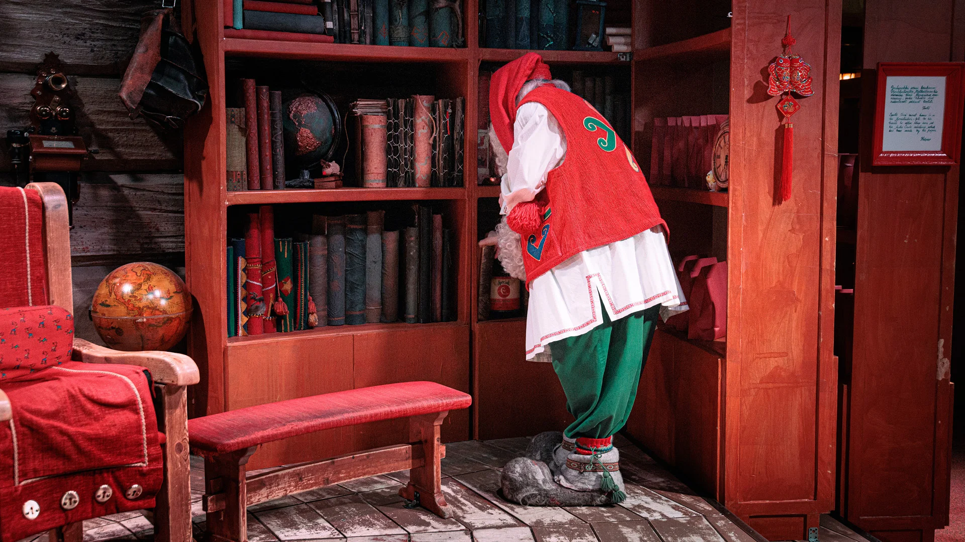 Santa Claus sorting books in his office Rovaniemi