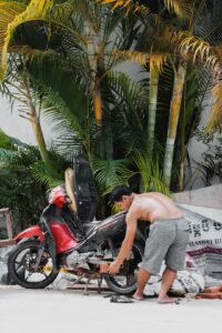 Ing Ing's father fixing his motor bike