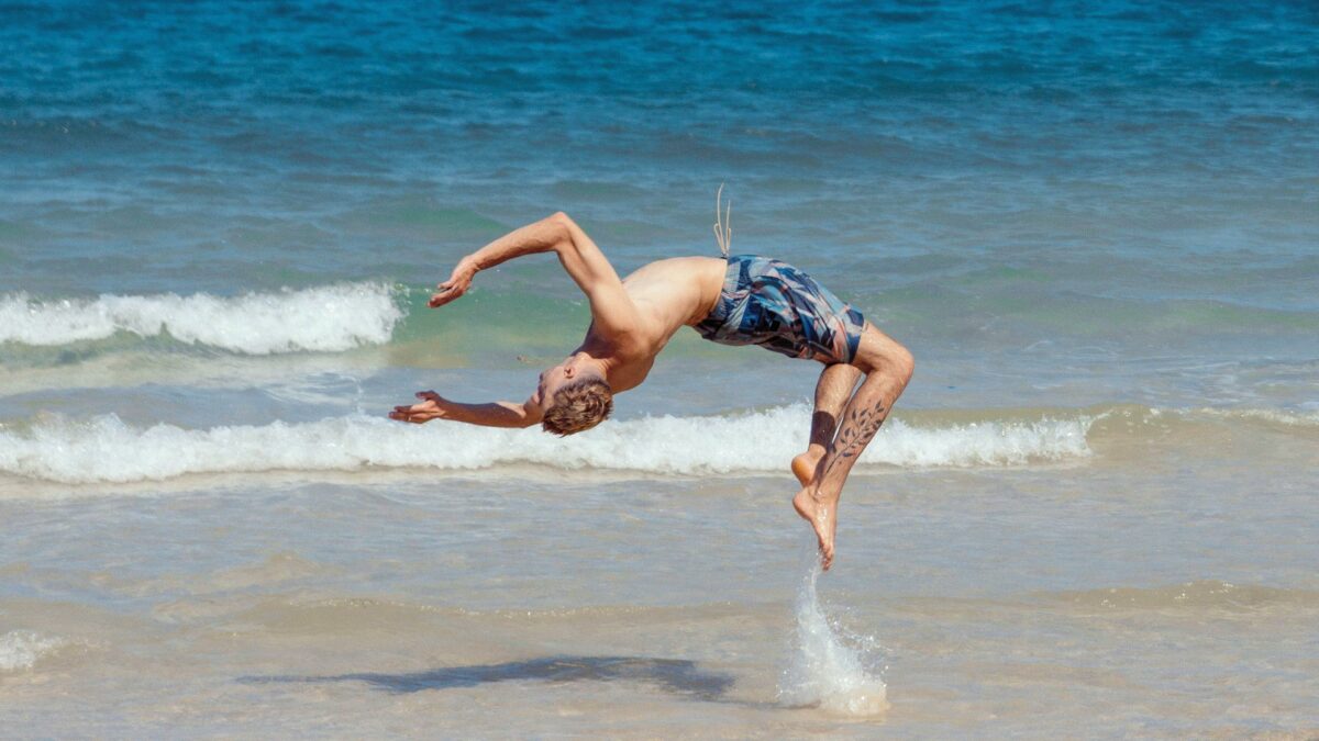 Virgile Beux doing salto on the beach