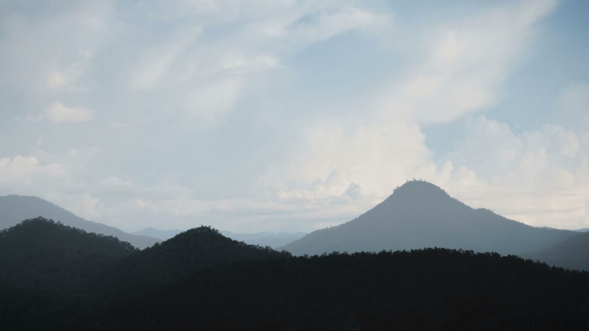 Landscape of mountains, blue sky with clouds. 