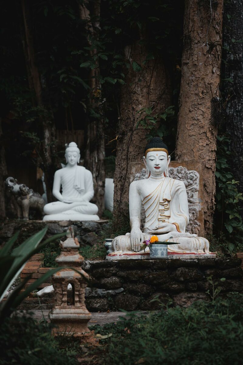 Statue of a white Buddha meditating, the art of doing nothing 