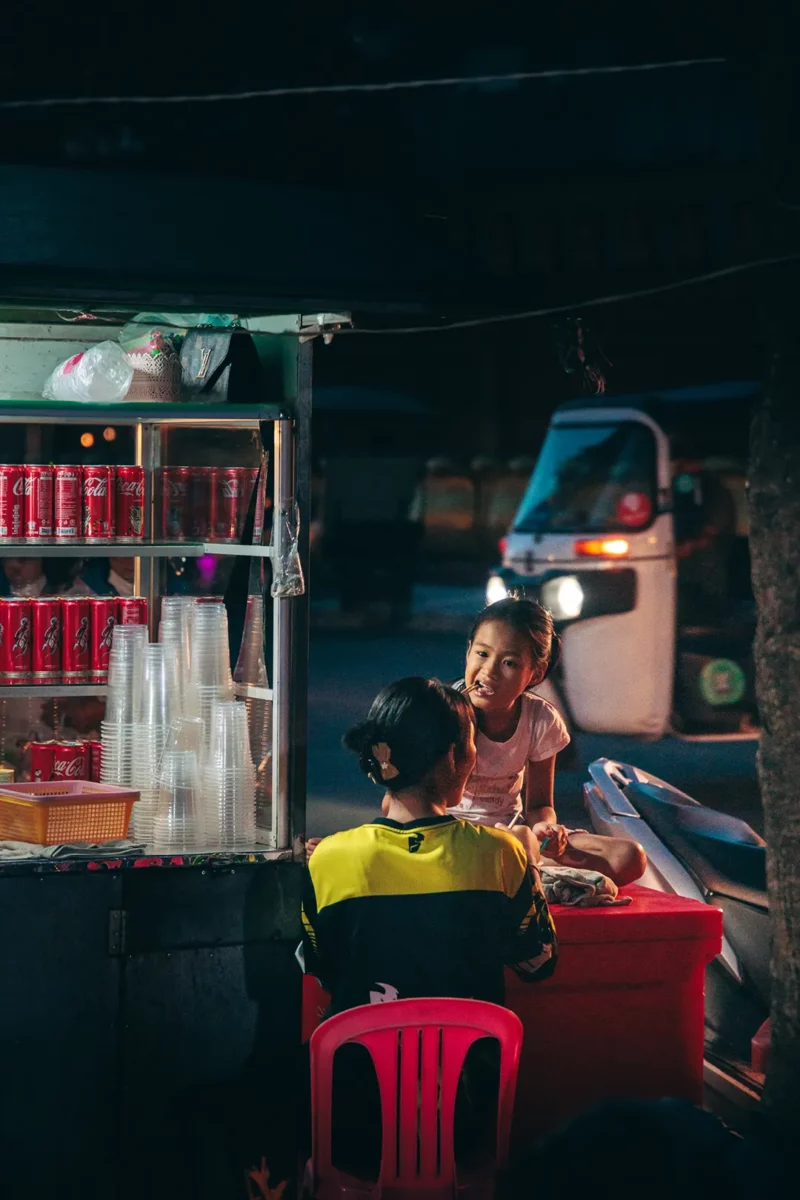 Kids eating street food in Siem Reap Cambodia
