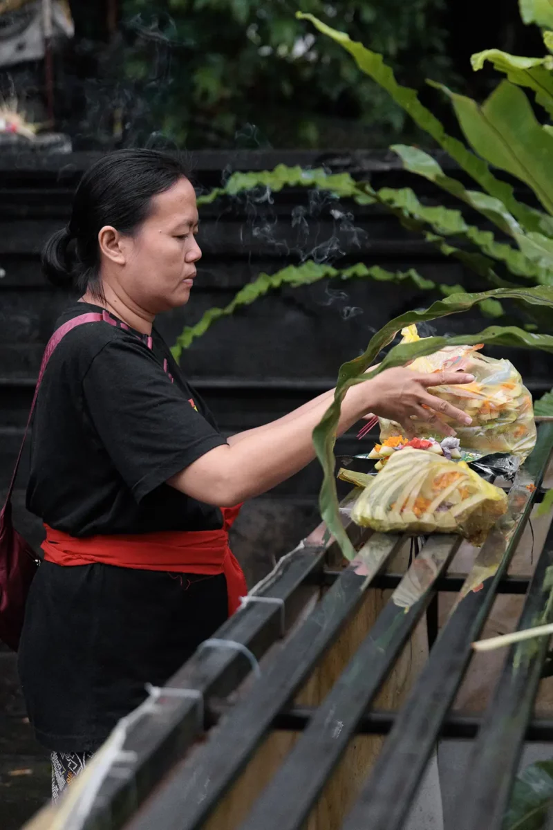 women preparing flower offering Bali indonesia