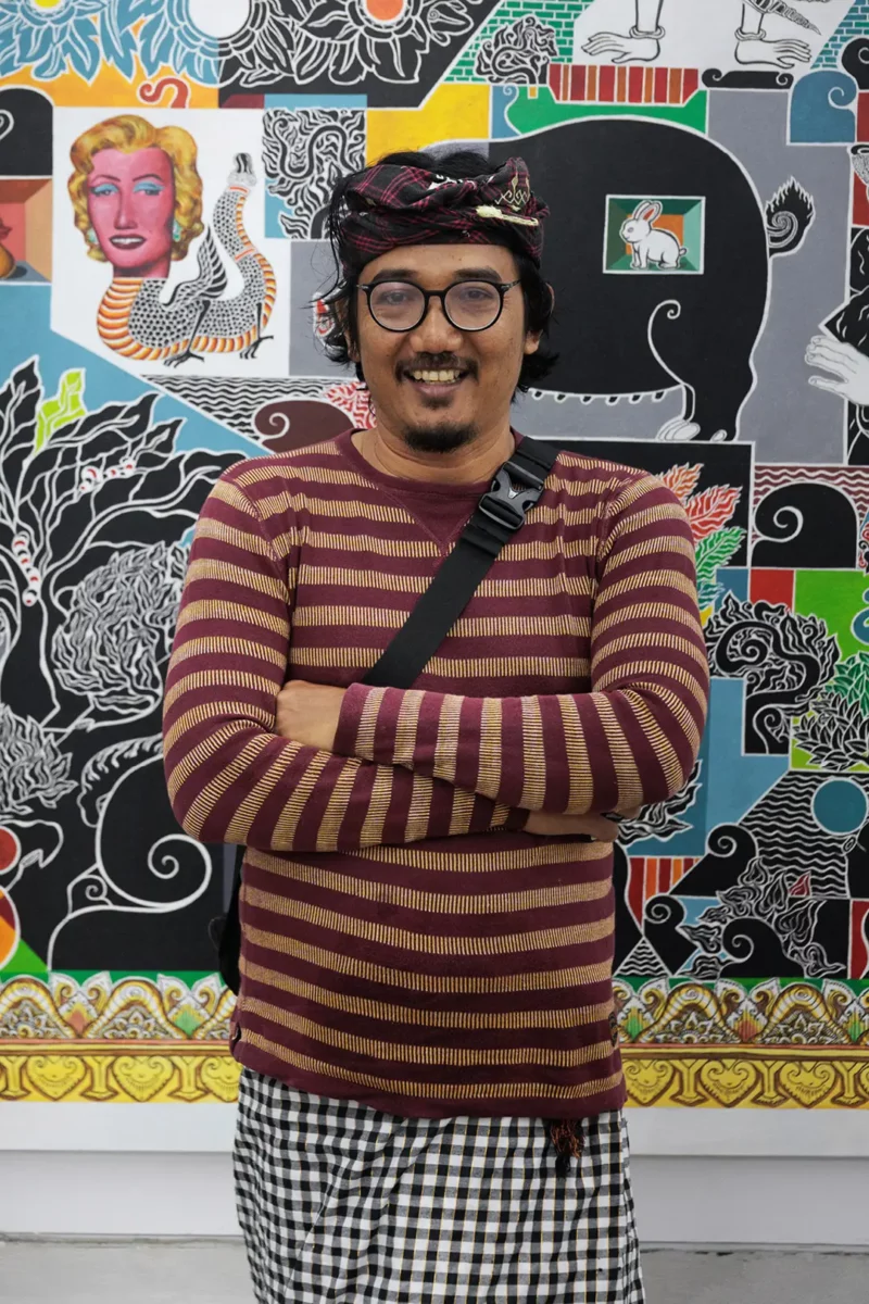 Ketut Suwidiarta In front of his painting
