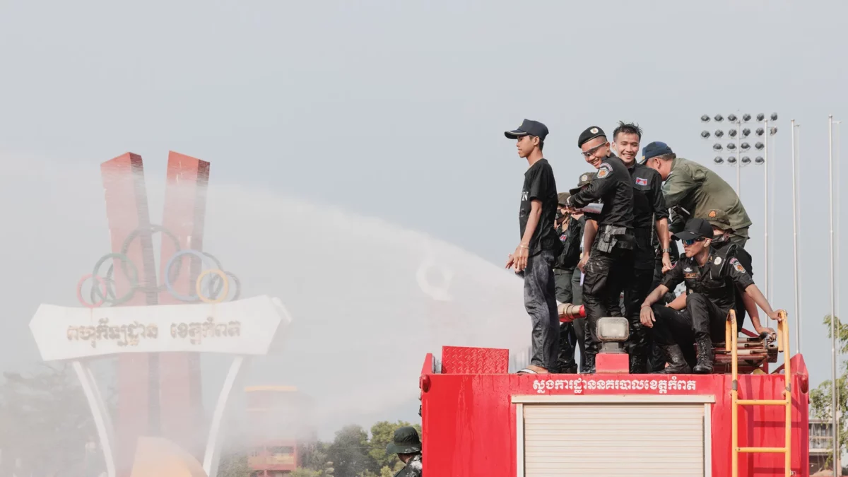 Cops on top of a firetruck in the durian roundabout during Choul Chnam Thmey, the Cambodian New Year 2023
