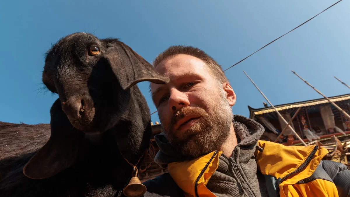 Selfie with a goat next to changunarayan temple and the Thangka Mandala school