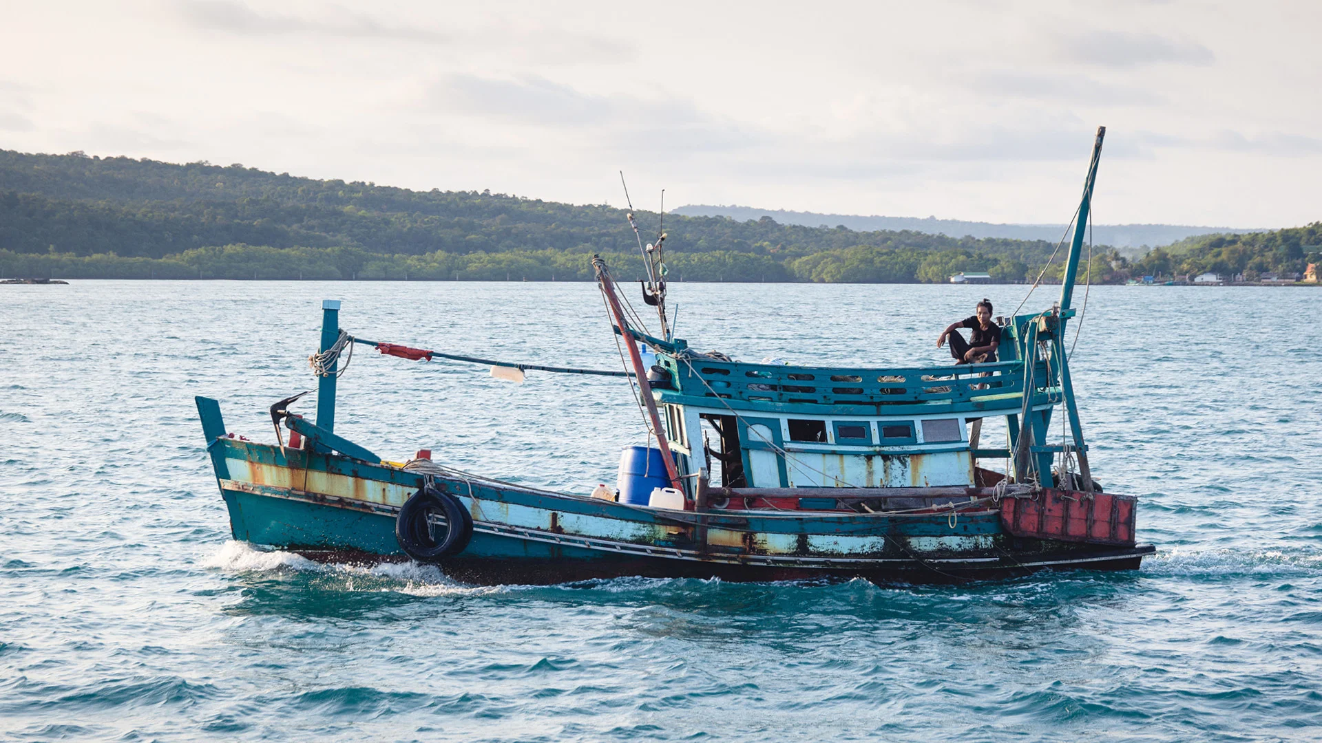 Fisher man on his boat in the Gulf of Thailand, Koh Rong Sanloem