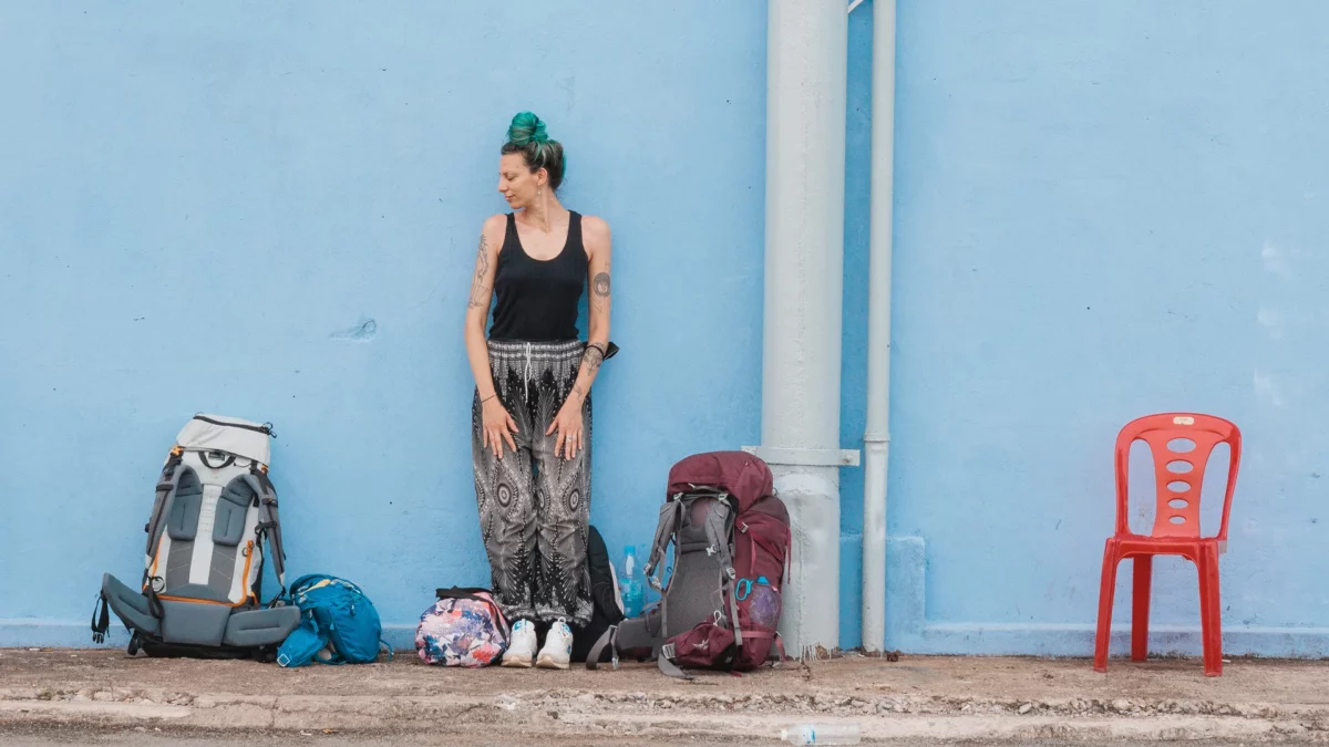 Backpacker girl waiting fro the boat to Koh Rong Sanloem, Sihanouk ville while