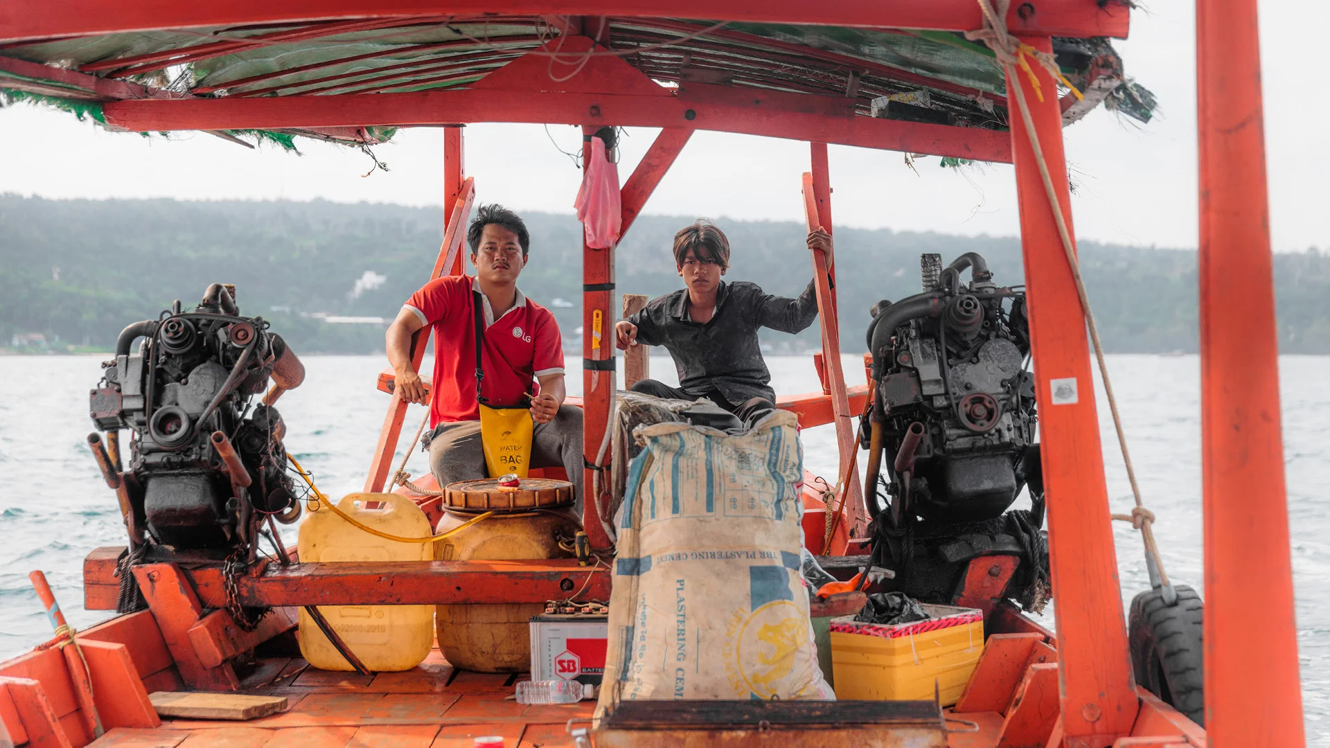 Long Boat driver and his son on the Gulf of Thailand