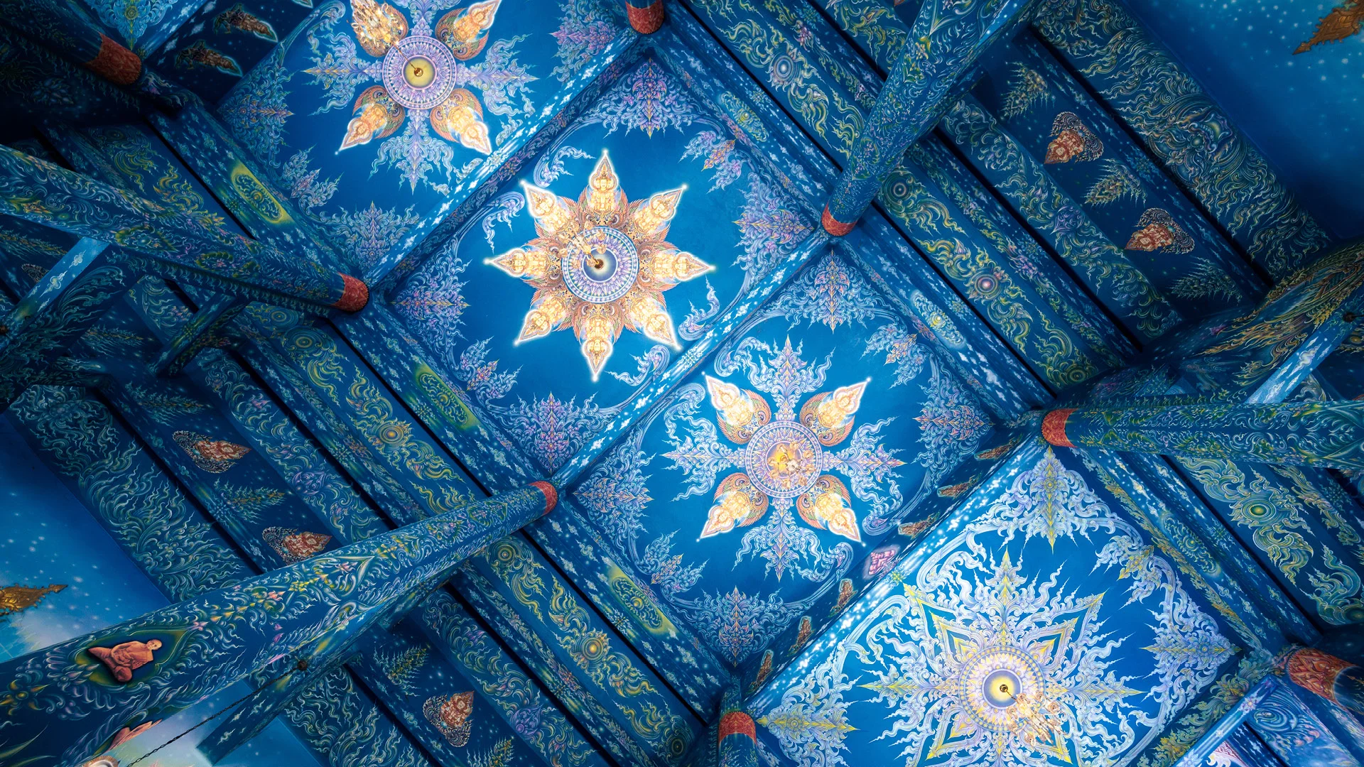 Detail of the ceiling of Wat Rong Suea Ten aka blue temple, Chiang Rai, Thailand