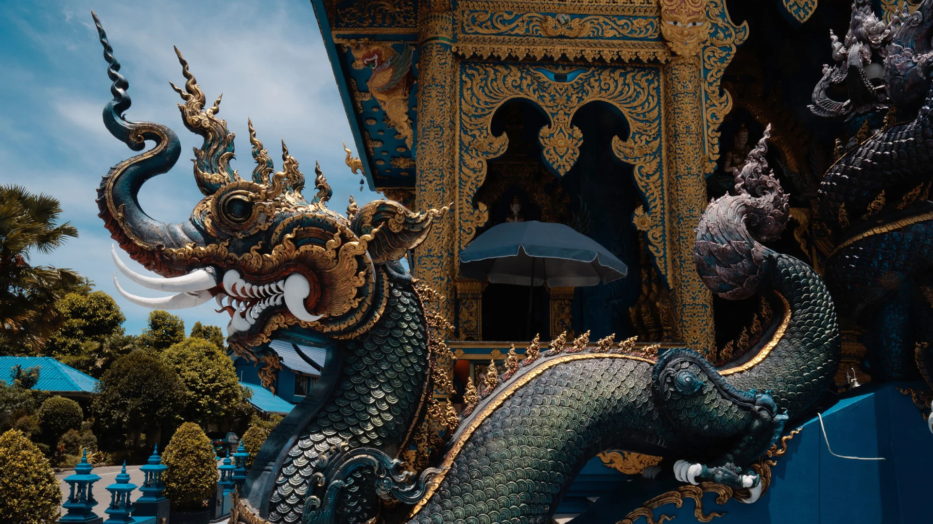 Scaled blue dragon in Wat Rong Suea Ten aka blue temple, Chiang Rai, Thailand