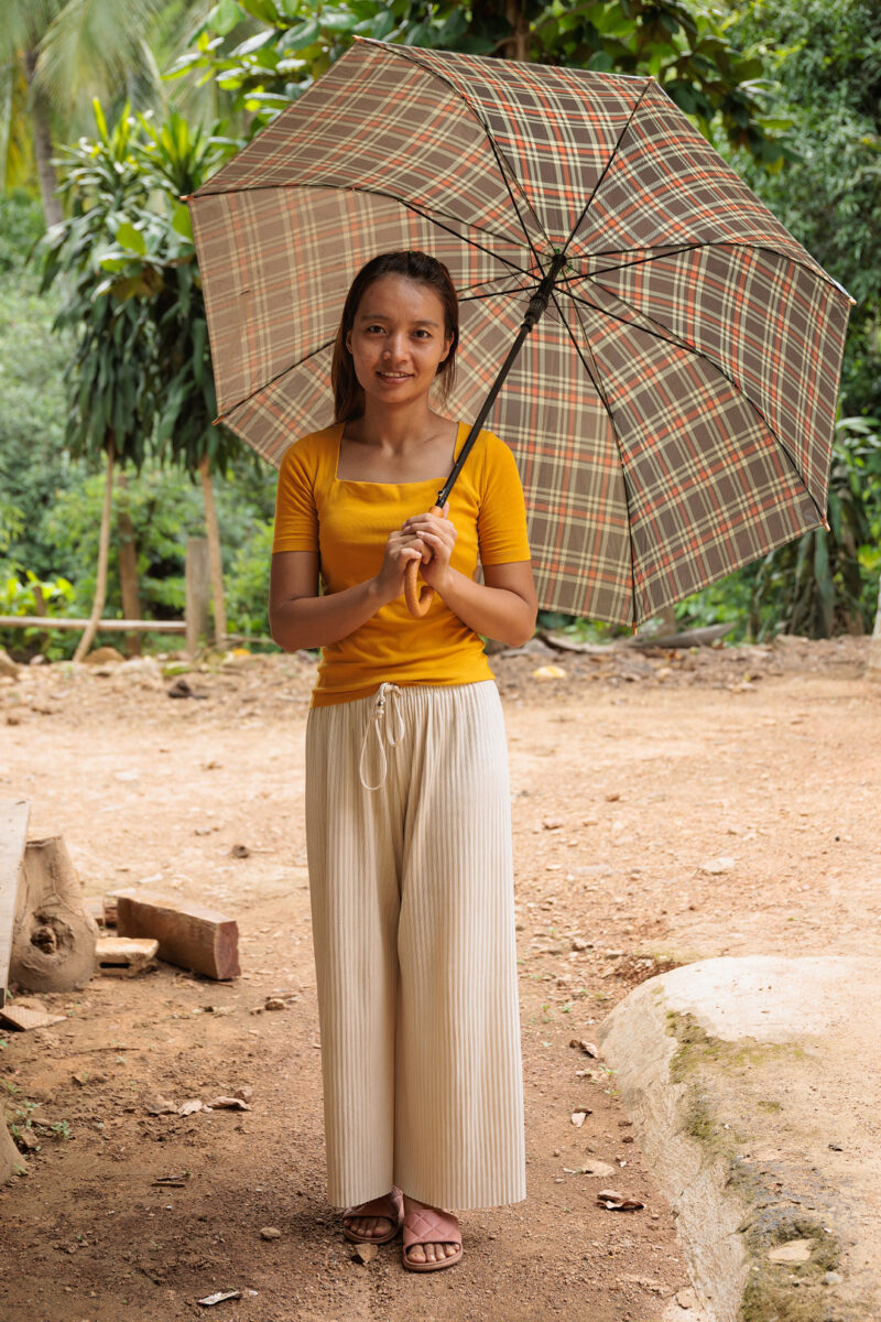 Karen woman with an umbrella, Huay Pu Keng, close to Mae Hong Son, Thailand