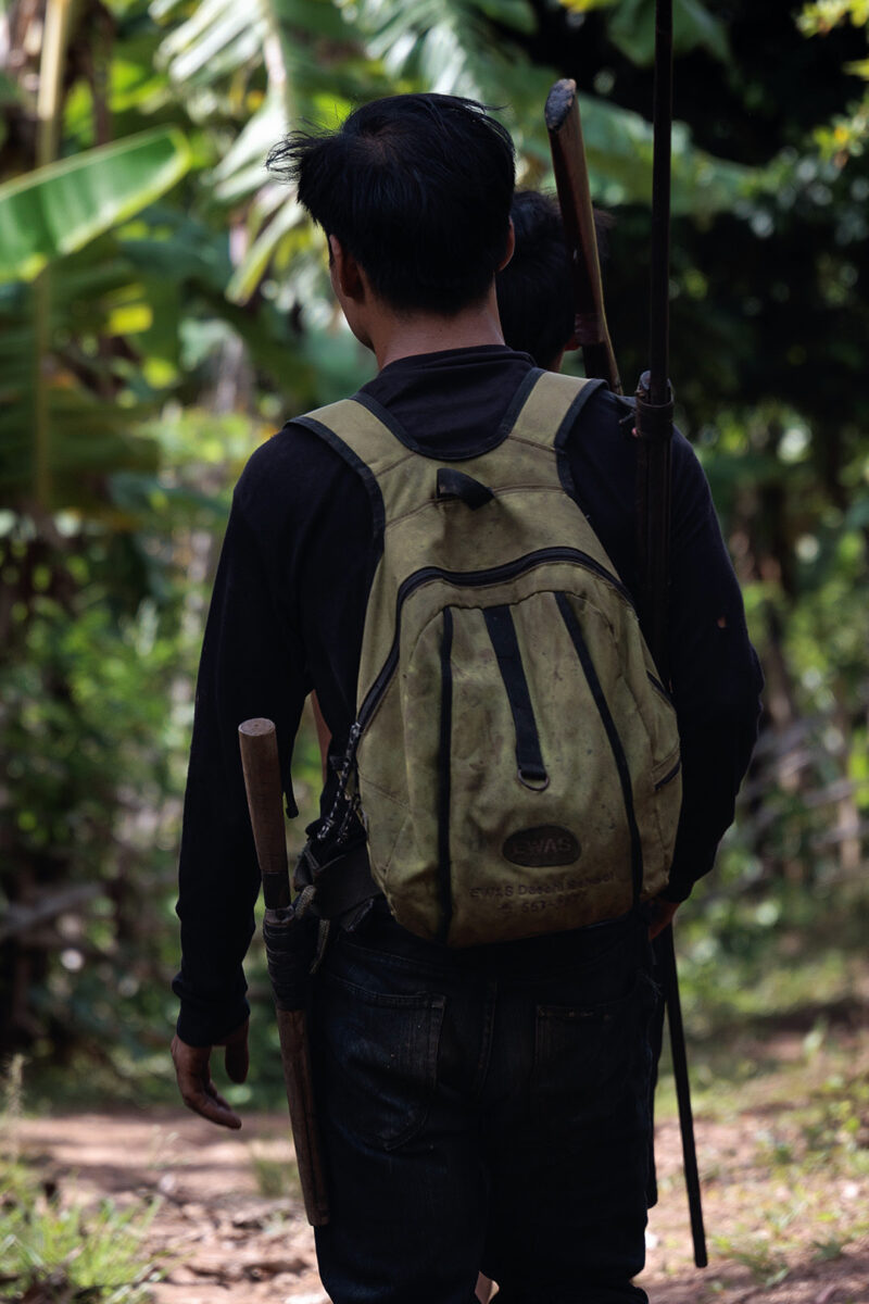 young Karen boy going hunting with the tribe rifle in Huay Pu Keng, Thailand