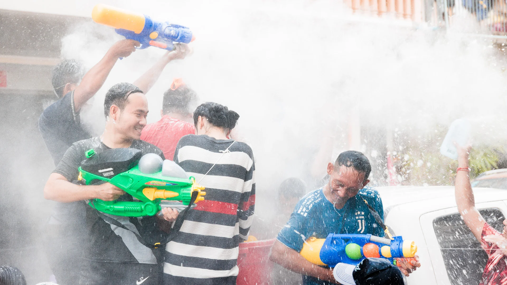 Best water gun and talcum fight New year in Cambodia, street of Kampot