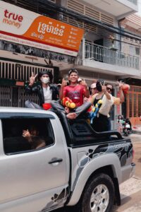 Teenager at the back of a pickup truck during New year in Cambodia