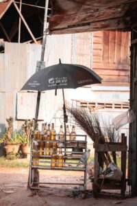 Shop with bottle of gazoline in the street of Siem Rea, Cambodia