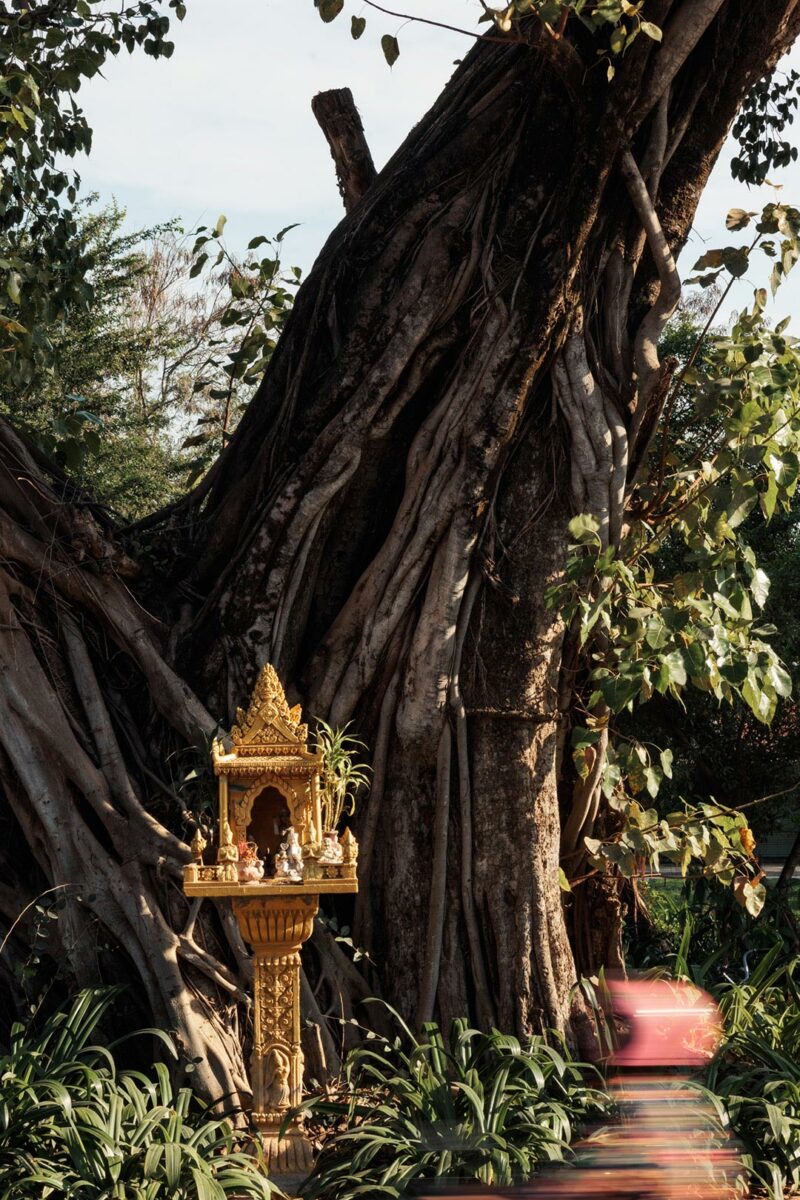 Spirit house in front of a pagoda - Siem Reap
