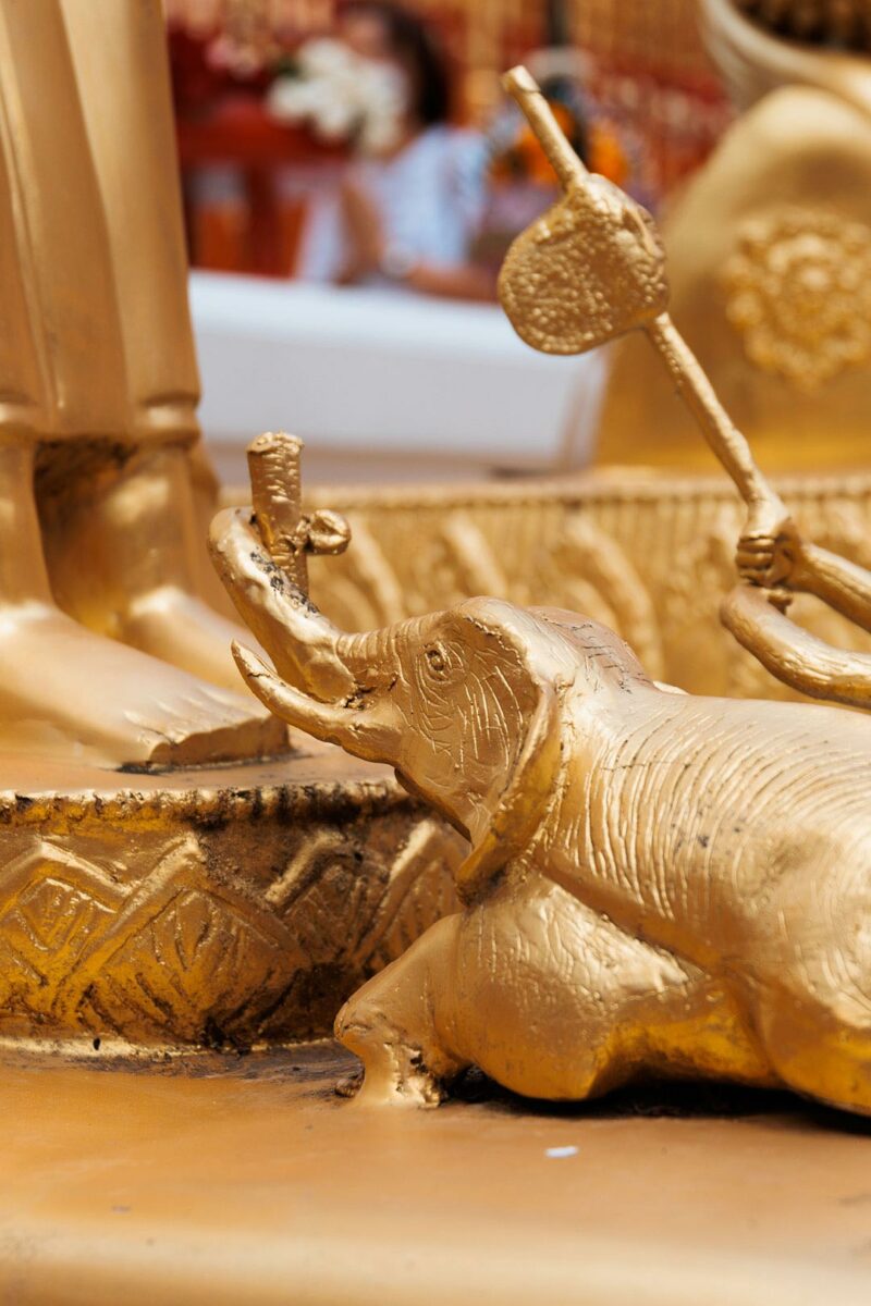Golden elephant at the feet of buddha, legend of the elephant - Wat Phrathat Doi Suthep - Chiang Mai - Thailand