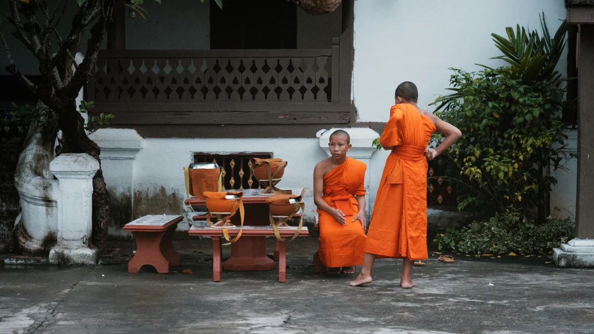 Luang Prabang in Laos, young monks waiting for the beginning of the the Alms Ceremony