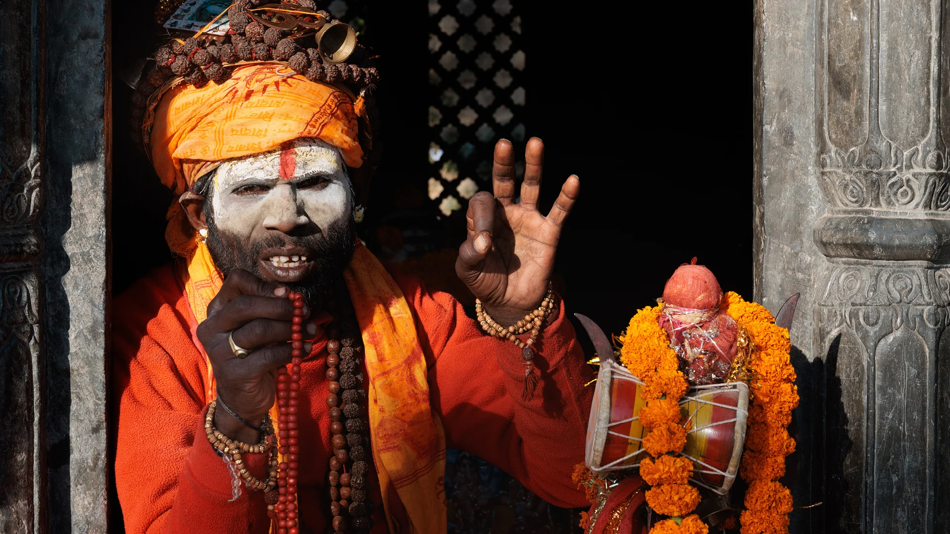 Colourful Sadhu with vayu mudra Pashupatinath temple Nepal