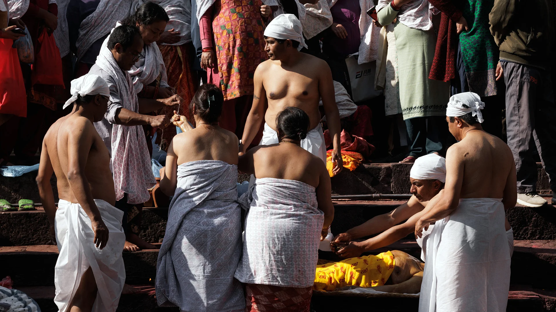 worshiper washing preparing a body in Pashupatinath temple Nepal