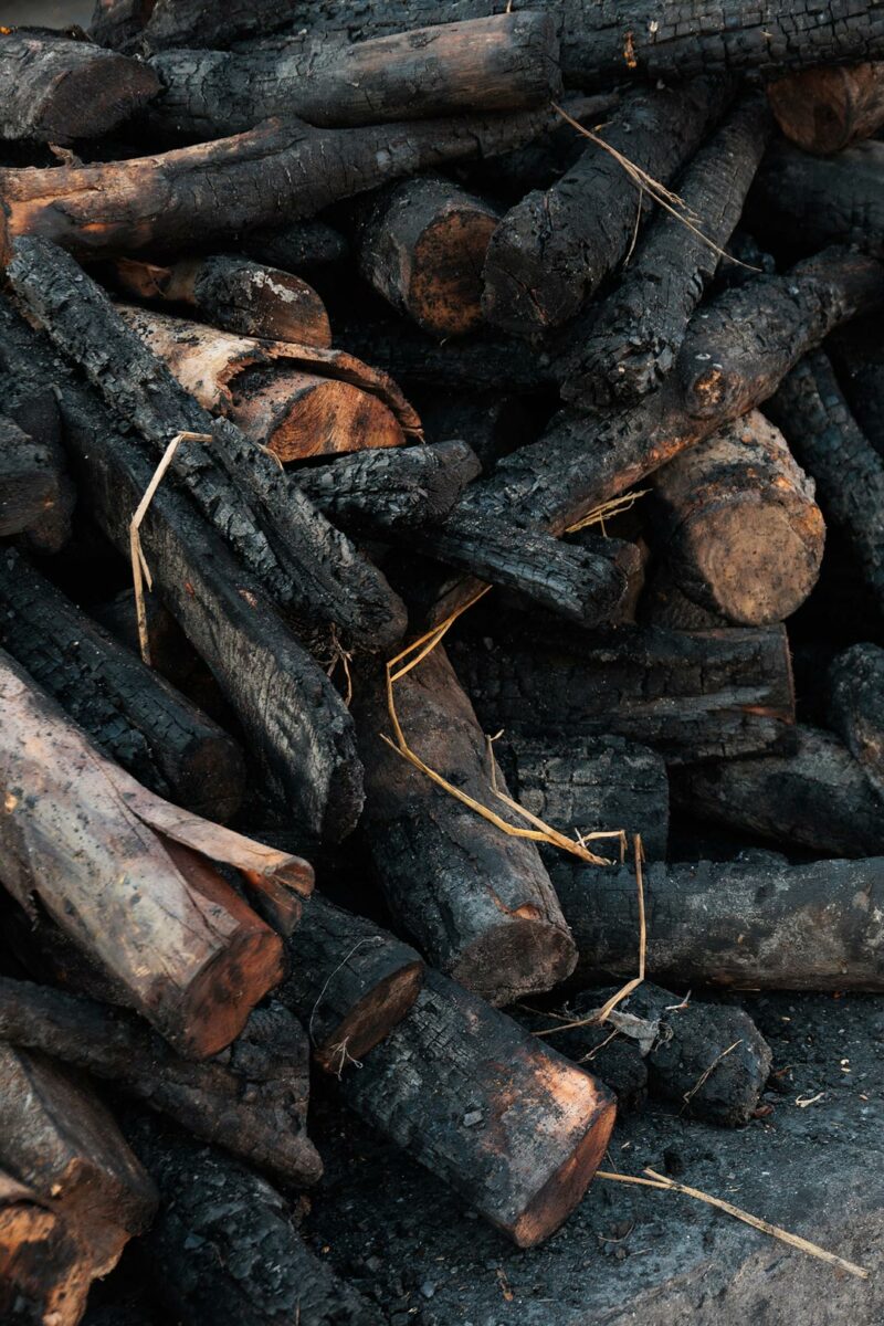 Stack of burned wood on the cremation ground.