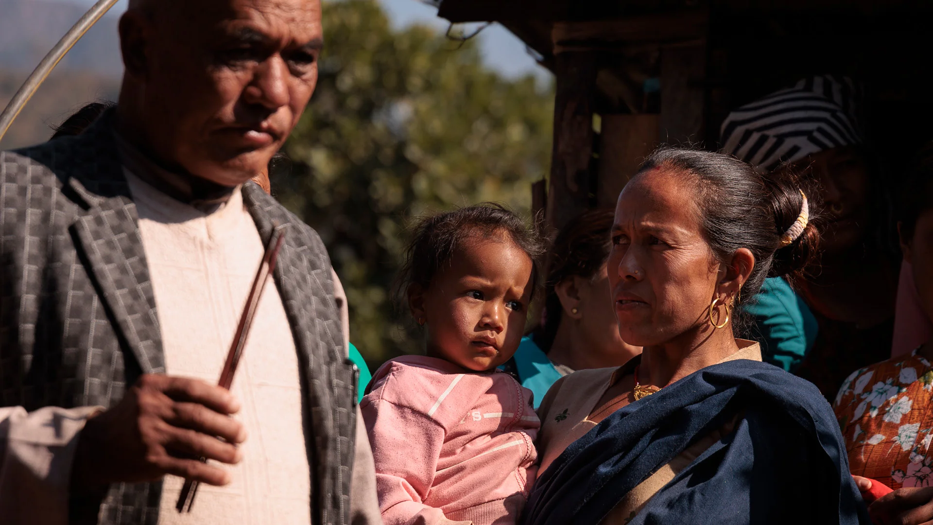 man, woman and kids, during a funeral in nepal