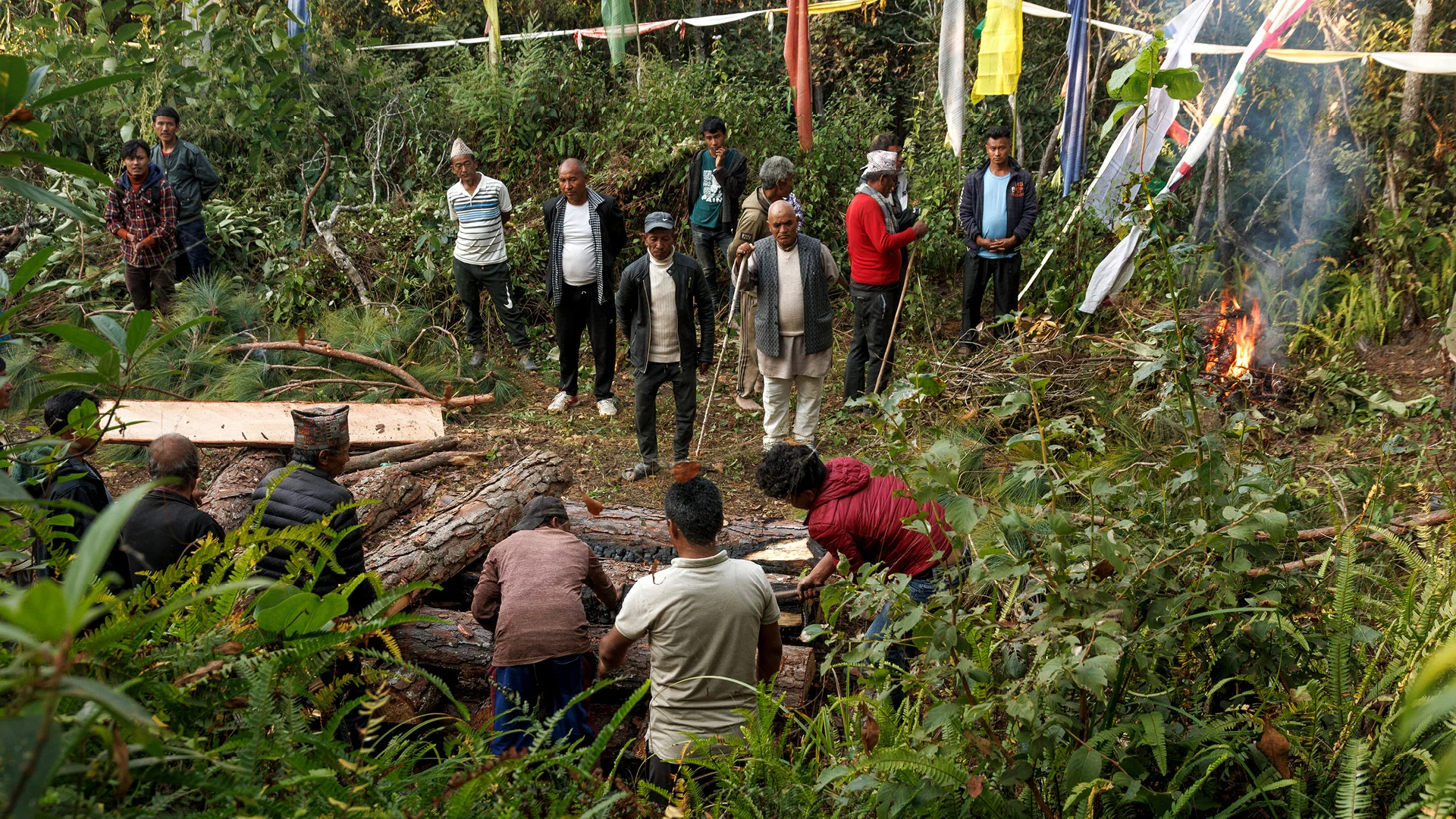 Men preparing a pire for a cremation in a remote nepalese village