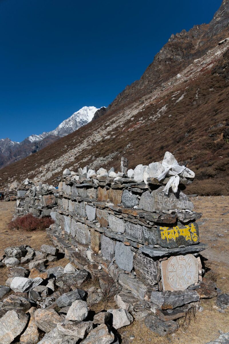 Mani stone on the path of my first trek in nepal, saying Om Mani Padme Hum