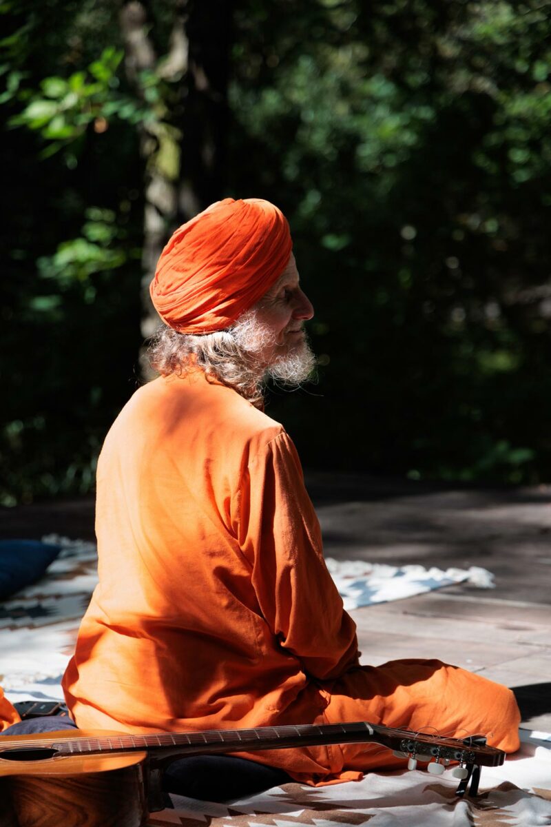 Morning circle, man meditating in the forest