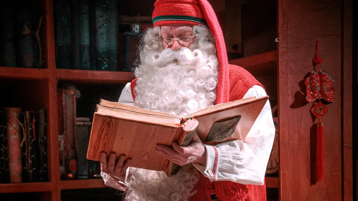 Santa Claus in Rovaniemi telling us stories from his memory book