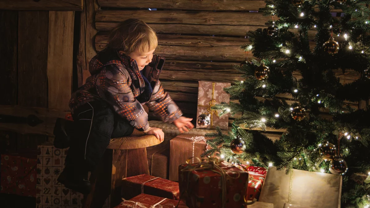 Kids close to the Christmas tree