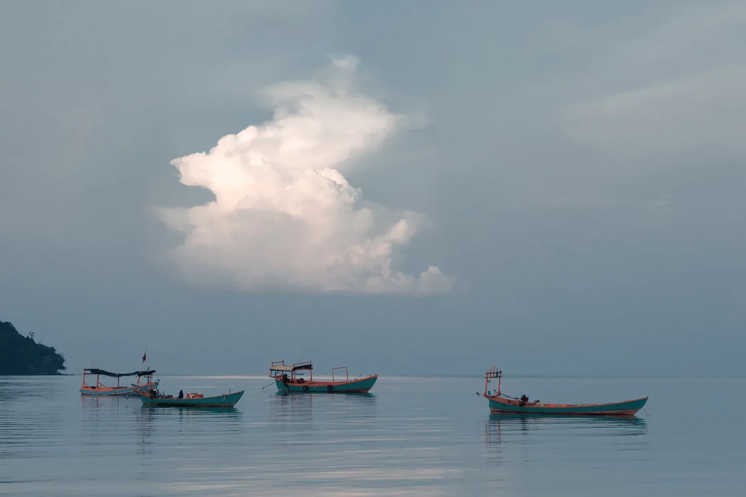 Clouds over the long boat in M'Pai Bay, Koh Rong Sanloem, Cambodia