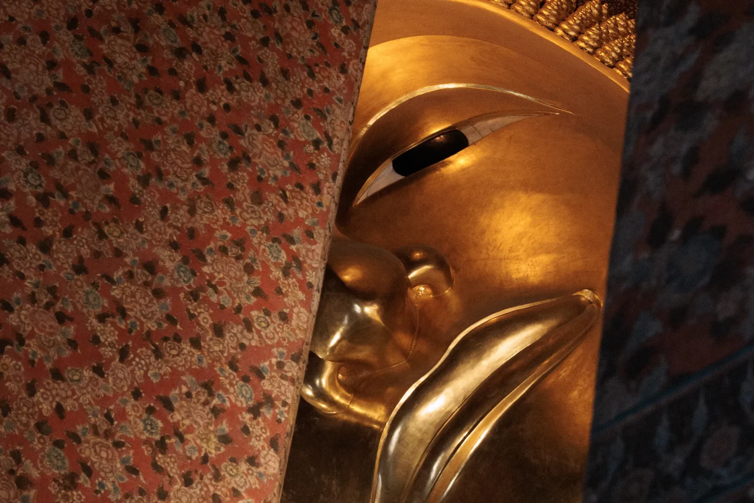 Face of giant golden buddha of Wat Pho, Bangkok thailand